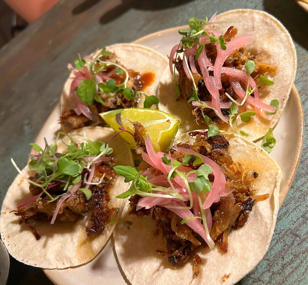 Buho Cocina y Cantina signature dishes Kalua Pork TacosMango Habanero ChickenDry Burrito